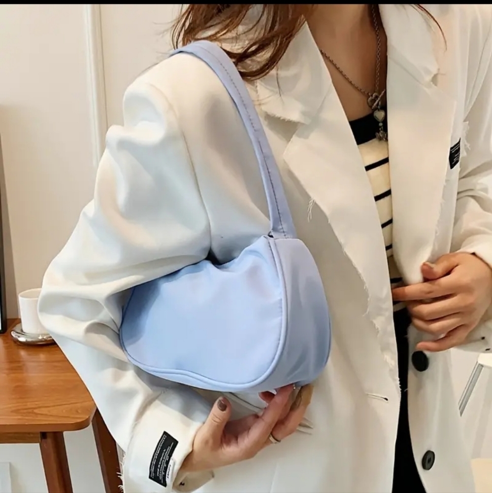 New handbag nylon purse in pale blue  1 zippered pocket 9 inch handle drop.